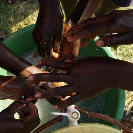 Children wash their hands at a school WASH club