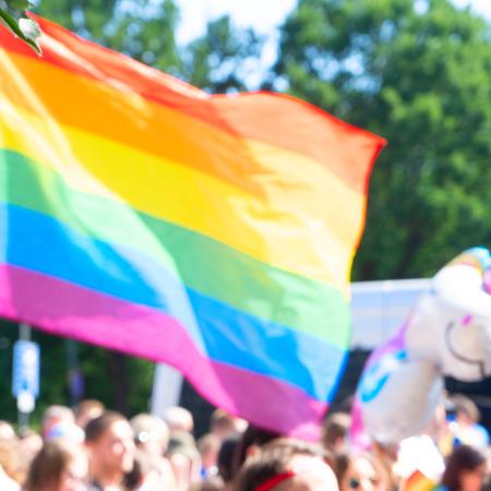 A picture of pride flag at a pride march.