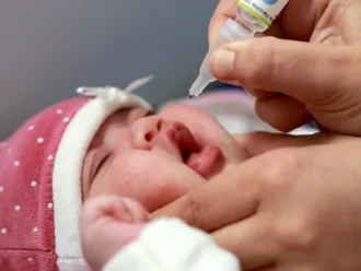 Two-month-old baby receives the crucial oral polio vaccine (OPV) drops. Algiers, November 2025
