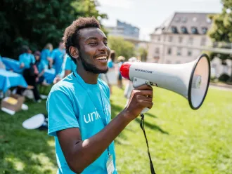 A youth speaking through microphone