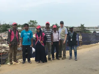 David Morley poses with UNICEF field workers.