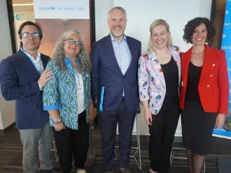 Group photo of the panel participants during the event. 