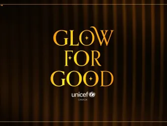 Gold “GLOW FOR GOOD” text centered over dark velvet curtains, with an ornate border and UNICEF Canada logo, creating a warm, elegant tone.