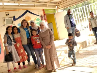 Bayan Yammout with school children in Zaatatri, Jordan.