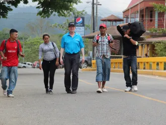 David Morley with Honduran youth migrants.