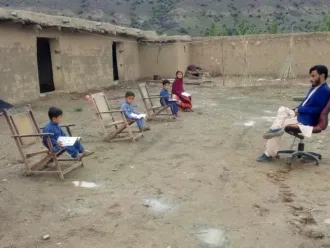 A man delivers a class in Sherani District in Balochistan. Support for the class was provided by the “My Home, My School” initiative.