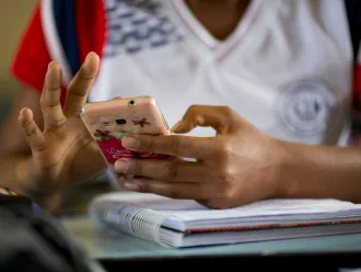 A student uses a mobile phone.