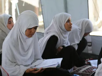 A 9-year old girl in class at a ‘tented school’ on the outskirts of Jalalabad town, eastern Afghanistan.