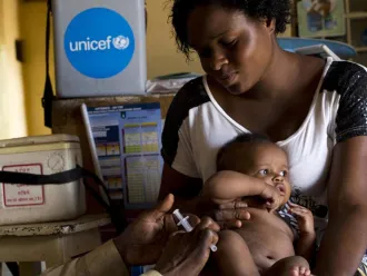baby receives vaccination in DRC