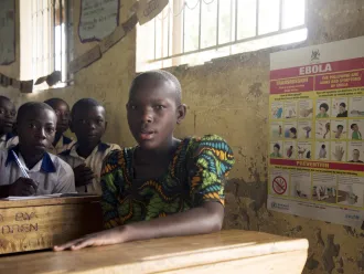 children sit in class