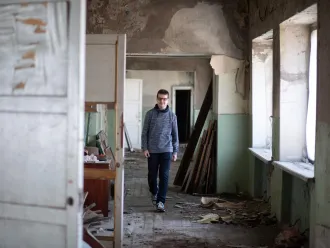 teen walking in a school
