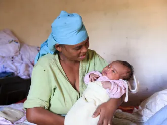 mother holds baby in Madagascar