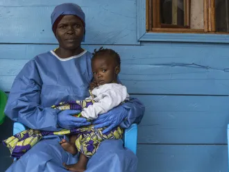 woman caring for children orphaned by Ebola