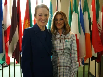 Executive Director of UNICEF Henrietta Fore posing for photo with Goodwill Ambassador Millie Bobby Brown at World Children's Day event in 2019.