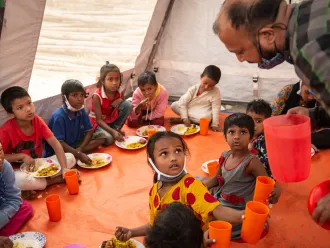 Children from the Child Protection Service Hub having their lunch