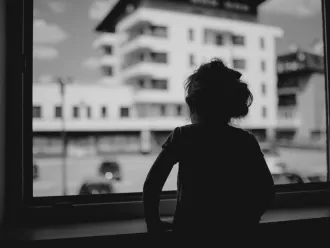 girl looking out of a window