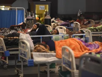 COVID-19 patients are treated in a makeshift ward in India.