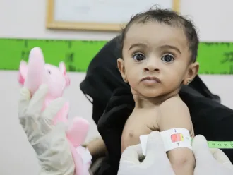 The child Imetanan Taha is 7 months old is being screened for malnutrition while visiting AlQutaee Stabilization Therapeutic Feeding Centre in AlMarawi’ah district, Hudaydah Gov, Yemen.