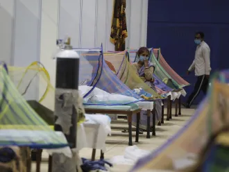 On 2 May 2021, patients receive treatment in the COVID-19 care centre at the Commonwealth Games Village (CWG) in New Delhi, India.