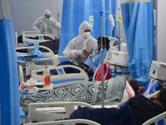 On 6 May 2021, patients receive treatment in the ICU ward at Mulund Jumbo's COVID-19 centre in Mumbai, India.