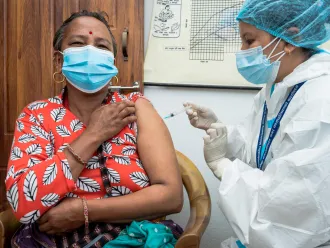 On 22 July 2021 at the Dapcha Health Post in Kavre District in central Nepal, 53-year-old Bijuli Devi Tamang receives the Johnson & Johnson COVID-19 vaccines donated to Nepal through the COVAX Facility. 