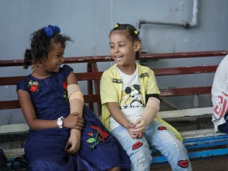 Malk, 7, and Abrar, 7, in the prosthetics centre in Aden, Yemen on 14 October 2021. Both children have a congenital disability and are receiving treatment in the centre