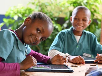 Children learn with tablets and computers in the Public Melen School of Yaoundé, the capital of Cameroon.