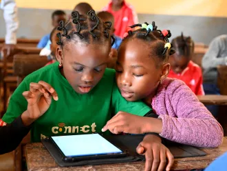 Children learn with tablets and computers in the Public Melen School of Yaoundé, the capital of Cameroon.