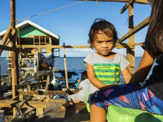 Gwendolyn Miano, 2, stands in the house her family has already started rebuilding December 20, 2021 in Barangay Fatima, Purok 1 in Ubay, Bohol, Philippines.