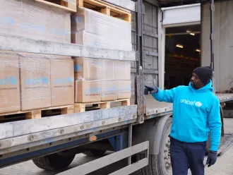 On 6 March 2022, a UNICEF staff inspects supplies that have just arrived in Lviv, western Ukraine, from UNICEF’s Global Supply and Logistics Hub in Copenhagen.