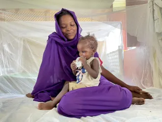 A girl receives ready-to-use therapeutic food in a stabilisation center in El Fasher, North Darfur. Unfortunately, the nutrition crisis is Sudan is worsening with a record number of children admitted to this center where children suffering from severe acute malnutrition with medical complications are treated.
