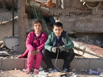 Two friends reuniting after the earthquake in Hatay.