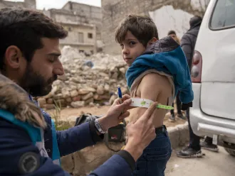On 10 February 2023, Ayman, 5, is screened for malnutrition by a UNICEF-supported mobile health team worker.