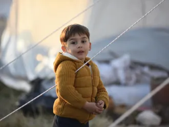 A boy at the temporary shelter set up for the survivors of the 7.7 magnitude earthquake in Kahramanmaraş, Türkiye.