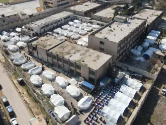 This aerial photograph shows tents at a temporary shelter for people affected by the earthquakes.