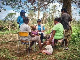 Sheenal & Esther, UNICEF staffs speaking with mothers who live in Red Graon community at Teouma.
