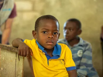A boy poses for a portrait during an interview with the beneficiaries of the clean water program run by UNICEF in Deye Morn, Jeremie, Haiti, Thursday, March 23, 2023.