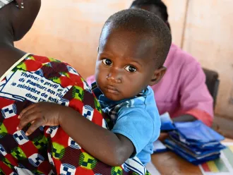A mother with her baby at the CSPS Health Center, in Fada, in the east of Burkina Faso.