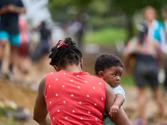 Esther, an Haitian mother of two children, arrives in pirogue to Lajas Blancas Migrant Temporary Reception Center, after crossing the Darien jungle with her husband. 