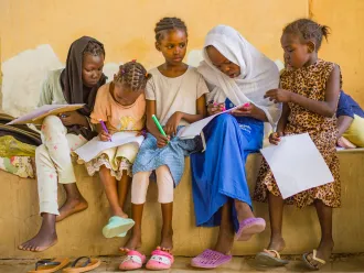 Displaced children engage in psychosocial activities at a gathering centre in Madani.