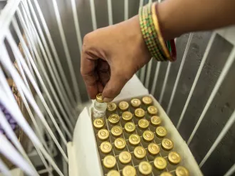 Pinky Kumari, Cold Chain Handler, prepares to keep vaccine in vaccine carriers at Primary health centre (PHE) in Begusarai, Bihar. 
