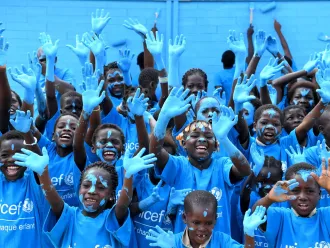 Children dressed in UNICEF t-shirts celebrating World Children’s Day