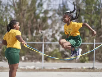On 11 December 2019 in The Bahamas, girls jump rope during a break at Hugh H. Campbell Primary School in Freeport.