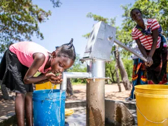 On 26 January 2020, Christine, 7, collects water from a recently rehabilitated water point in Gwembe Valley, Zambia. Severe and prolonged drought in the region have contributed to depleted water points, crop failure, food insecurity and malnutrition, impacting the health of mothers and children. To date, under the Zambian Government's drought response plan, UNICEF has supported the rehabilitation of a dozen existing boreholes in Gwembe District. In total, UNICEF will drill 100 new boreholes and rehabilitate