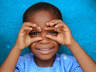 Happy child smiling in Gonzagueville, in Abidjan, Côte d'Ivoire.