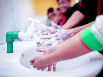 Children wash their hands at a primary school in Vietnam.