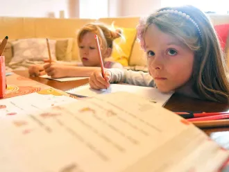 Skopje, 24 March 2020: Twins Ana (7) and Kaja (7) follow the TV-classroom programme with the same level of seriousness they usually do when at school.