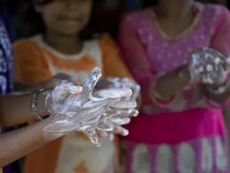 Rohingya children practice handwashing exercises.