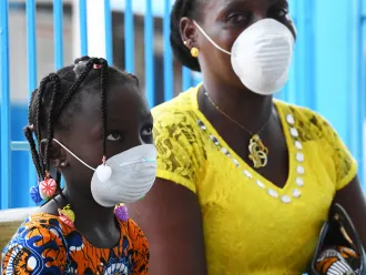 Mother and daughter wearing face masks