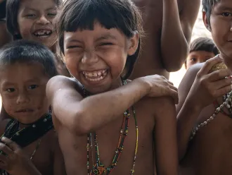 Children show off where they received vaccination shots.